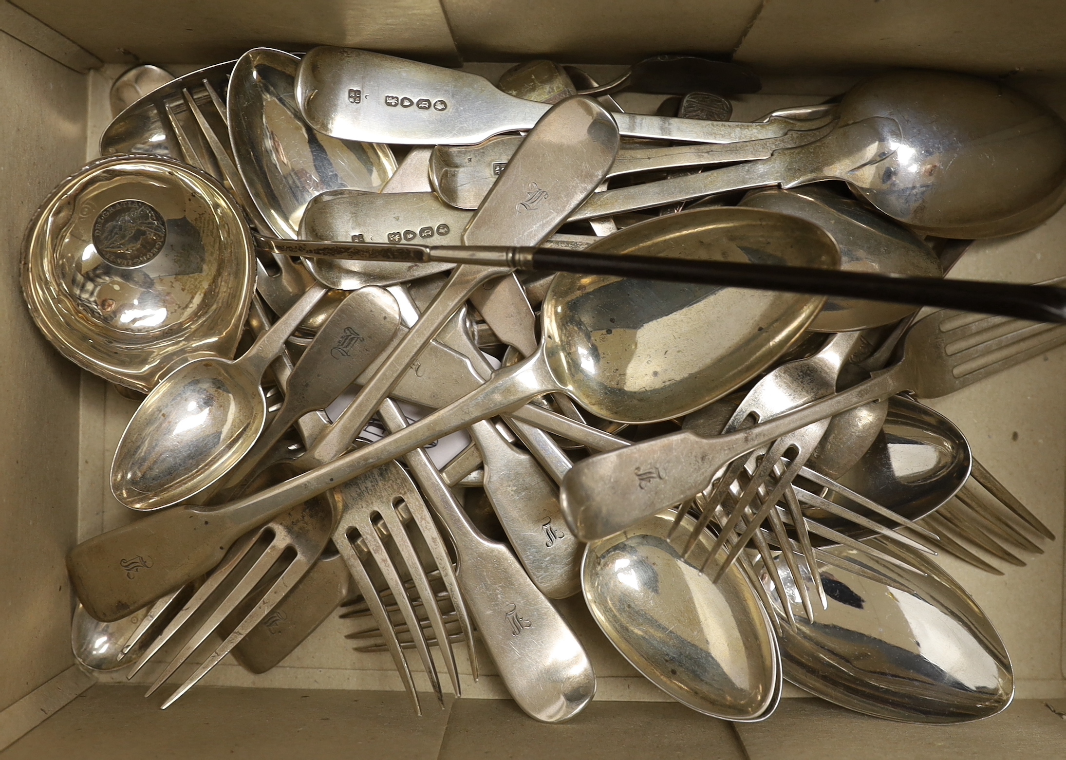 A set of six silver fiddle pattern table and six dessert forks by William Eaton, London, 1836, a set of six Victorian provincial silver fiddle patter dessert spoons, Josiah Williams & Co, Exeter, 1853 and eleven other as